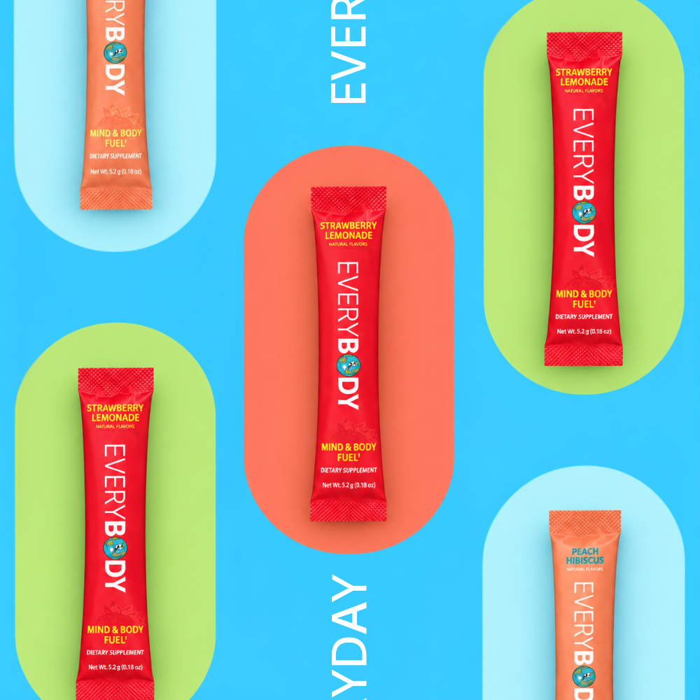 Four single-serve beverage replacement sticks from EVERYBODY are arranged on a bright blue background with pastel arch shapes. The center stick is red and labeled Strawberry Lemonade, while the surrounding sticks are orange and peach, labeled Apple Juice, Strawberry Lemonade, and Peach Refreshers.