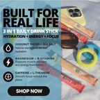 Promotional graphic for a 3-in-1 daily drink stick from EVERYBODY. The image features three colorful stick packets (yellow, pink, and orange) alongside a yellow phone case, sunglasses, a blue coiled earphone, and a blue towel background.